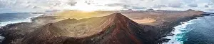 Steady Shot Prints: aerial panorama view on volcano and mountains on coast with ocean waves on lanzarote during sunrise