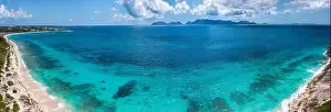 Aerial panoramic of Cove Bay near Cap Juluca with Saint Martin in the distance on the island of Anguilla