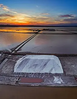 Yield Prints: Aerial panoramic drone view of Burgas salt pans townscape at sunse.Saltworks industry