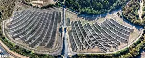 Photovoltaic Prints: Aerial panoramic drone view of a farm of solar panels between crop fields