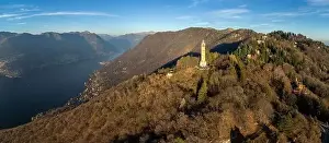 Lake Como Prints: Aerial panoramic drone view of a lighthouse over Lake Como skyline with sunset light - Faro Voltiano (Volta Lighthouse)