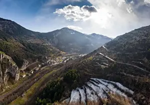 Drone Landscape Prints: Aerial panoramic drone view of a scenic highway by the beautiful Landscape covered in clouds and fog