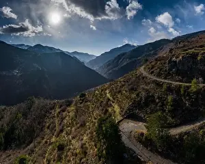 Drone Landscape Prints: Aerial panoramic drone view of a scenic highway by the beautiful Landscape covered in clouds and fog