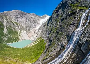 Sky Mountain Prints: Aerial panoramic by drone of waterfall above Briksdalsbreen glacier
