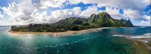 Kauai Prints: Aerial panoramic image off the coast over Tunnels beach on Hawaiian island of Kauai with Na Pali mountains behind