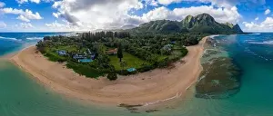 Kauai Prints: Aerial panoramic image off the coast over Tunnels beach on Hawaiian island of Kauai with Na Pali mountains behind