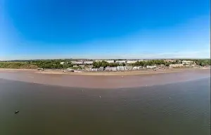 British Coastline Prints: Aerial panoramic photo of the seaside village of Filey in the UK showing a wide view image of the sea front