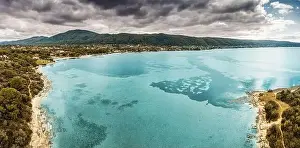 Vourvourou Prints: Aerial panoramic scenic view of azure blue lagoon and paradise bay with majestic patterns on a sea shelf