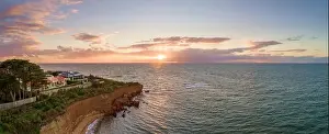 Coastlline Prints: Aerial panoramic seascape of luxury houses on a cliff at sunset