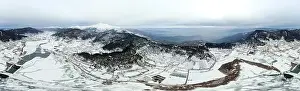 Aerial Panoramic shot of Odemis Bozdag and lake Golcuk with snow in winter season. Shot with a drone