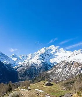 Log Cabin Prints: Aerial panoramic of snow capped Monte Disgrazia and huts at Alpe Oro
