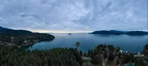 Aerial Panoramic view of a beautiful Canadian Landscape during a cloudy winter sunset