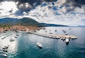 Azure Water Prints: Aerial panoramic view of city Komiza - the one of numerous port towns in Croatia