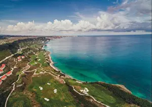 Aerial panoramic view of a golf course next to the cliffs and Black sea. Golfing fields landscape