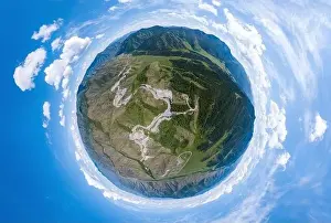 Aerial panoramic view of planet earth near a Chike-Taman pass in the Altai mountains with green trees