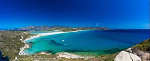 Aerial done panoramic view of Porto Giunco beach and tower in Villasimius, Sardinia, Italy