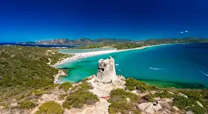 Watchtower Prints: Aerial done panoramic view of Porto Giunco beach and tower in Villasimius, Sardinia, Italy