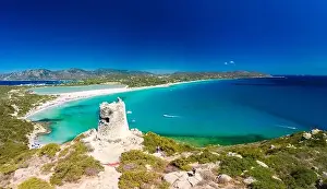 Aerial done panoramic view of Porto Giunco beach and tower in Villasimius, Sardinia, Italy