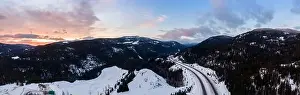 Merritt Prints: Aerial Panoramic View of a scenic Highway passing in the Canadian Mountain Landscape during a colorful winter sunrise
