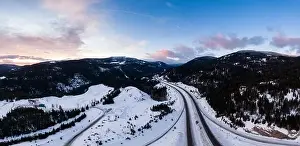 Merritt Prints: Aerial Panoramic View of a scenic Highway passing in the Canadian Mountain Landscape during a colorful winter sunrise