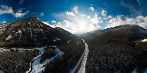 Revelstoke Prints: Aerial Panoramic View of a scenic Highway in the valley between Canadian Mountain Landscape during winter sunny sunset