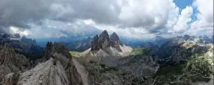 European Alps Prints: Aerial panoramic view of Tre Cime di Lavaredo mountain during a sunny day with clouds and fog in the Dolomites