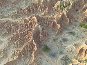 Dramatic Scenery Prints: This aerial perspective captures the rugged terrain of the Tatacoa Desert