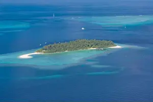 Aerial photo of beautiful paradise Maldives tropical lagoon with coral reef beach on island. Summer and travel vacation concept.View from seaplane