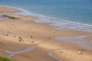 Whitby Prints: Aerial photo of the beautiful town of Whitby in the UK in North Yorkshire in the UK showing people on the sandy beach
