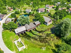 Aerial photo of Majerovo Vrilo, set of wooden mill houses on the source of Gacka river in the village of Sinac, Croatia