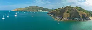Yatch Prints: aerial photography above wind turbine on hilltop beside the sea near Promthep cape viewpoint creative nature