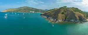 Yatch Prints: aerial photography above wind turbine on hilltop beside the sea near Promthep cape viewpoint creative nature
