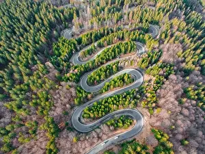 Serpentine Road Prints: Aerial photography of a winding road in the mountains with serpentines and curves