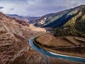 The aerial picture of the scenic road (Chui tract) and the Katun river in the Altai Mountains in Siberia, Russia