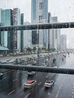 Emirates Prints: Aerial rooftop view of Dubai traffic on Sheik Zayed Road on a rainy day