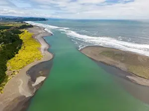 River Mouth Prints: Aerial shot of the point where the river Tolten flows into the pacific ocean in Araucania