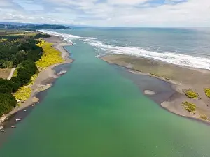 River Mouth Prints: Aerial shot of the point where the river Tolten flows into the pacific ocean in Araucania