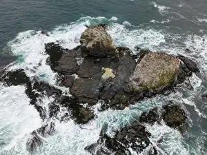 Surfers Prints: Aerial shot of the scenic birds rock at Punta de Lobos at Pichilemu, Chile