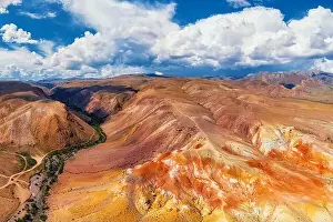 Red Mountains Prints: Aerial shot of the textured yellow nad red mountains resembling the surface of Mars