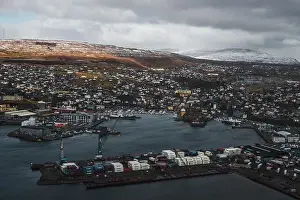 Explore Denmark Prints: Aerial shot of the town Torshavn and its harbour as taken during a helicopter flight on an early spring morning