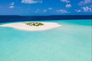 Images Dated 3rd August 2019: Aerial tropical paradise, small island in shallow blue lagoon. Ocean water, deep sea endless horizon