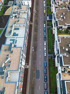 Condo Prints: A top aerial, vertical view of a modern street in an apartment complex with bicycle paths and street