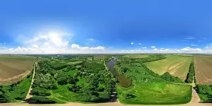 Aerial View: 360 degree shooting of Beautiful River and Green Meadows. Turn right. Magestic landscape