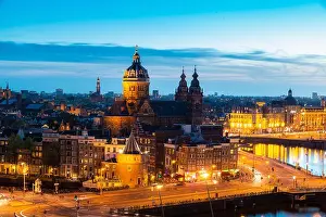 Aerial view of Amsterdam skyline in historical area at night in Amsterdam, Netherlands