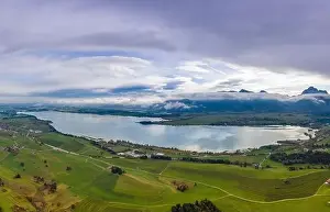 Forest Mountain Prints: aerial view to artificial quarry pond forggensee lake at fall