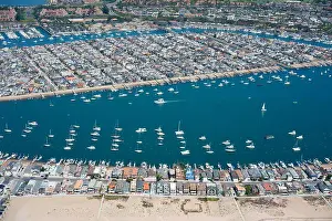 Beachfront Prints: AERIAL VIEW. Balboa Peninsula in the foreground with Balboa Island behind