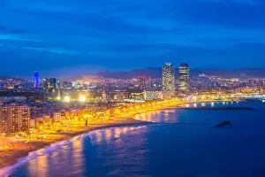 Aerial view of Barcelona Beach in summer night along seaside in Barcelona, Spain. Mediterranean Sea in Spain