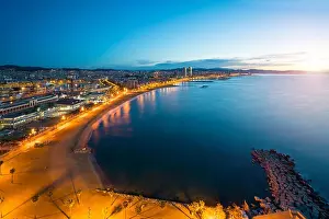 Aerial view of Barcelona Beach in summer night along seaside in Barcelona, Spain. Mediterranean Sea in Spain