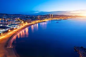 Aerial view of Barcelona Beach in summer night along seaside in Barcelona, Spain. Mediterranean Sea in Spain