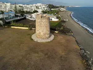 Marbella Prints: aerial view of the beach of linda vista next to the tower of las bóvedas in the municipality of Marbella